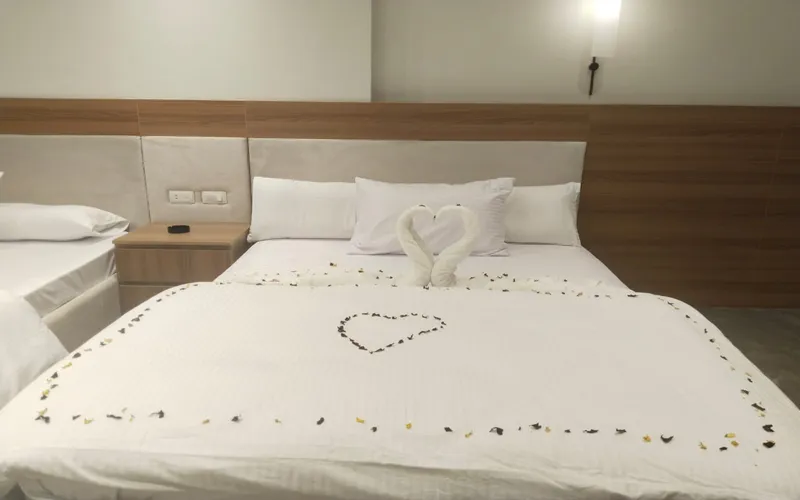 Luxury bed in a hotel room in a mini hotel in Nasr City